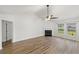 Spacious living room with vaulted ceiling, fireplace, and wood-look floors at 5040 Thornton Dr, Summerville, SC 29485
