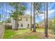 Grassy backyard featuring a patio with outdoor seating, ideal for entertaining at 523 Kilarney Rd, Summerville, SC 29483