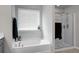 Bathroom with a soaking tub and glass-enclosed shower, perfect for relaxation at 523 Kilarney Rd, Summerville, SC 29483
