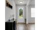 Inviting entryway features beautiful floors, natural light, and a view to the backyard through the front door at 523 Kilarney Rd, Summerville, SC 29483