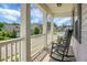 Inviting front porch featuring classic rocking chairs and views of the neighborhood at 523 Kilarney Rd, Summerville, SC 29483