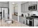 Modern kitchen featuring granite countertops, stainless steel appliances, and shaker style cabinets at 523 Kilarney Rd, Summerville, SC 29483