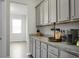 Kitchen featuring grey cabinets, granite countertops, stainless steel appliances, and modern hardware at 523 Kilarney Rd, Summerville, SC 29483