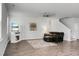 Bright and inviting living room with hardwood floors, a decorative fireplace, and a cozy seating arrangement at 523 Kilarney Rd, Summerville, SC 29483