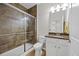 Full bathroom featuring tiled shower with glass door and granite vanity at 548 Sea Foam St, Summerville, SC 29486