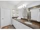 Bathroom vanity with double sinks and tiled walk-in shower and white towels at 548 Sea Foam St, Summerville, SC 29486