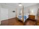 Bedroom with dark hardwood floors and four poster bed at 548 Sea Foam St, Summerville, SC 29486