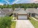 A beautiful home with a stone and siding front, well-maintained landscaping, and a spacious driveway at 548 Sea Foam St, Summerville, SC 29486