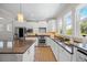 Modern kitchen with stainless steel appliances, a large island, granite countertops, and ample cabinet space at 548 Sea Foam St, Summerville, SC 29486