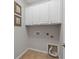 Functional laundry area with overhead cabinets and utility connections at 548 Sea Foam St, Summerville, SC 29486