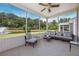 Spacious screened porch with nice seating and beautiful outdoor pond views at 548 Sea Foam St, Summerville, SC 29486