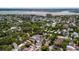 High-angle view of the neighborhood featuring tree-lined streets, a serene lake, and picturesque waterfront scenery at 6 Kirkland Ln, Charleston, SC 29401