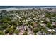 Expansive aerial view of a neighborhood showcasing lush green trees and beautiful waterfront in the background at 6 Kirkland Ln, Charleston, SC 29401
