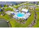 Overhead view showcases the community pool, playground, bocce ball court and surrounding residences at 627 Chigwell Springs Ln, Summerville, SC 29486