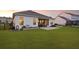 The house features a spacious backyard with a well-maintained lawn, patio, and a cozy screened porch at 627 Chigwell Springs Ln, Summerville, SC 29486
