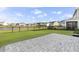 This home features a serene backyard, complemented by a lush lawn, brick patio, and picturesque pond views at 627 Chigwell Springs Ln, Summerville, SC 29486