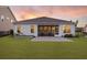 A perfect backyard with a large lawn, screened porch, and patio, providing an ideal outdoor living space at 627 Chigwell Springs Ln, Summerville, SC 29486