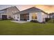 Expansive backyard featuring a manicured lawn, privacy fence and screened porch, perfect for relaxing and entertaining at 627 Chigwell Springs Ln, Summerville, SC 29486