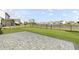 Enjoy the scenery from the home's backyard, complete with a well-kept lawn and brick patio at 627 Chigwell Springs Ln, Summerville, SC 29486
