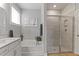 This bathroom features a soaking tub, a stand up shower and lots of light at 627 Chigwell Springs Ln, Summerville, SC 29486