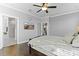 This bedroom features a ceiling fan, hardwood floors, and easy access to an ensuite bath at 627 Chigwell Springs Ln, Summerville, SC 29486