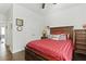 Bedroom features dark wood accents, hardwood floors, ceiling fan, and double closet for ample storage at 627 Chigwell Springs Ln, Summerville, SC 29486