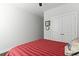 Bedroom showcasing red and white striped bedspread and double closet for ample storage at 627 Chigwell Springs Ln, Summerville, SC 29486