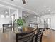 An open layout connects the dining room to a modern kitchen and living space at 627 Chigwell Springs Ln, Summerville, SC 29486