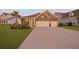 Charming brick home featuring a manicured lawn, a two-car garage and beautiful landscaping at 627 Chigwell Springs Ln, Summerville, SC 29486