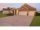 Attractive brick home with a two-car garage and a manicured lawn at 627 Chigwell Springs Ln, Summerville, SC 29486