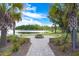 Picturesque lakeside fire pit area with brick walkway, perfect for relaxing and enjoying the scenery at 627 Chigwell Springs Ln, Summerville, SC 29486