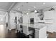 Bright, white kitchen with stainless steel appliances, large island, granite countertops, and pendant lighting at 627 Chigwell Springs Ln, Summerville, SC 29486