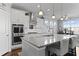 Modern kitchen featuring granite countertops, stainless steel appliances, and a breakfast bar at 627 Chigwell Springs Ln, Summerville, SC 29486