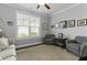 The living room is decorated with an area rug and comfortable seating at 627 Chigwell Springs Ln, Summerville, SC 29486