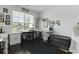 This room features a large window, hardwood floors, and multiple shelving units at 627 Chigwell Springs Ln, Summerville, SC 29486