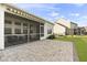 Relax on the patio connected to the screened porch, ideal for outdoor entertaining and leisure at 627 Chigwell Springs Ln, Summerville, SC 29486