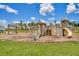 Well-maintained playground area featuring slides, climbing structures, and a seating area, perfect for families at 627 Chigwell Springs Ln, Summerville, SC 29486