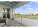 Enjoy outdoor living on this screened porch with an extended brick patio and community pond views at 627 Chigwell Springs Ln, Summerville, SC 29486