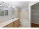 Bathroom with double vanity, tub, and closet access at 700 Daniel Ellis Dr # 11302, Charleston, SC 29412