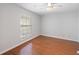 Simple bedroom with hardwood flooring and a bright window at 700 Daniel Ellis Dr # 11302, Charleston, SC 29412