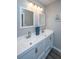The bathroom features a double vanity, a large countertop, updated lighting, and modern fixtures at 717 Temple Road # B, Ladson, SC 29456