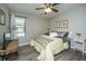 A comfortable bedroom offering neutral decor and ample natural light from a large window at 717 Temple Road # B, Ladson, SC 29456