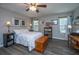 Cozy bedroom with light-filled windows, modern ceiling fan and luxury vinyl plank flooring at 717 Temple Road # B, Ladson, SC 29456