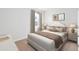 Cozy bedroom features neutral tones, a plush bed, and elegant decor, creating a relaxing atmosphere at 744 Meadowbrook Ln, Summerville, SC 29486