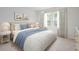 Inviting bedroom featuring soft bedding, stylish side tables, and a bright window for natural light at 744 Meadowbrook Ln, Summerville, SC 29486