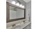 Bathroom featuring double sink vanity, large framed mirror, and modern lighting at 7838 Long Shadow Ln, North Charleston, SC 29406
