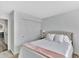Bedroom with neutral carpet, closet, and luxurious queen sized bed at 7838 Long Shadow Ln, North Charleston, SC 29406