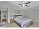 A serene bedroom with a comfortable bed, soft lighting, and ample closet space creates a relaxing retreat at 7838 Long Shadow Ln, North Charleston, SC 29406
