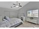 The primary bedroom with vaulted ceilings and an integrated makeup vanity allows for comfort and beauty at 7838 Long Shadow Ln, North Charleston, SC 29406
