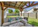 Inviting covered patio with comfortable seating and views of the landscaped yard at 7838 Long Shadow Ln, North Charleston, SC 29406